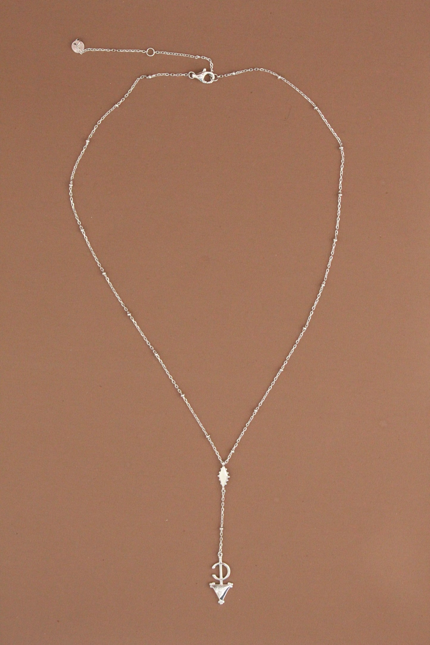 Platinum Plated Fibula Drop Necklace ©